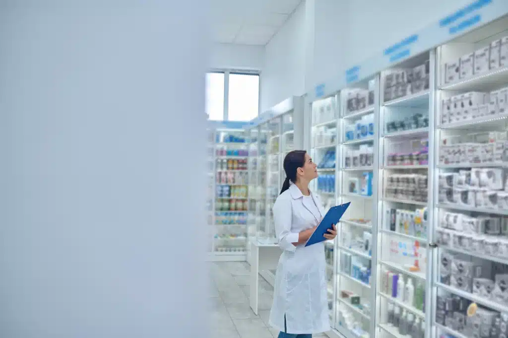 pharmacist checking medicines drugstore